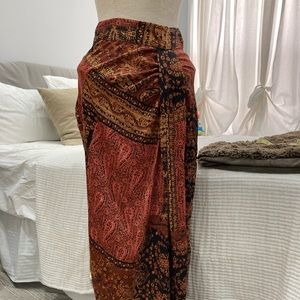 Silky long skirt with ruching detail in front.